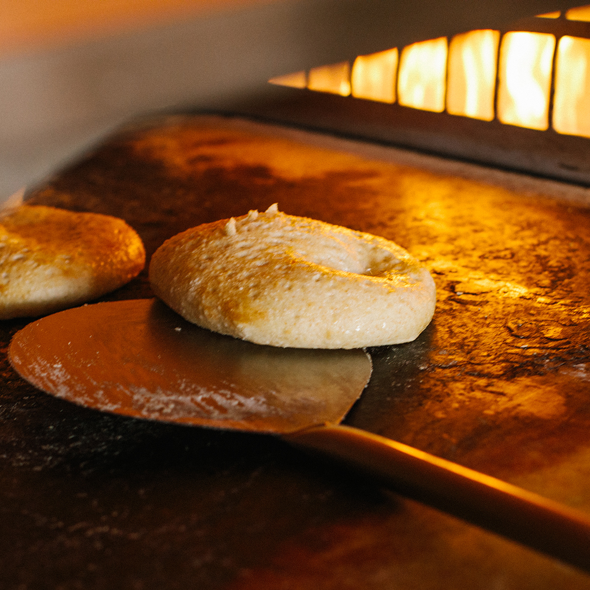 warm foccacia bread coming out of the hearth oven