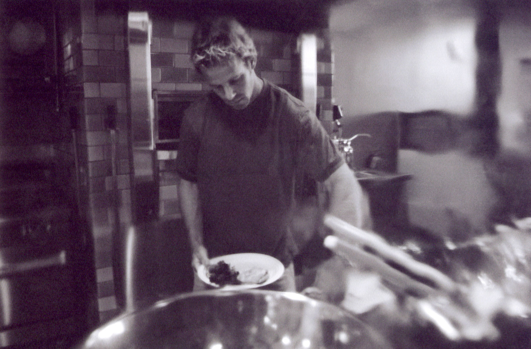 Urbane Cafe owner Tom Holt preparing food